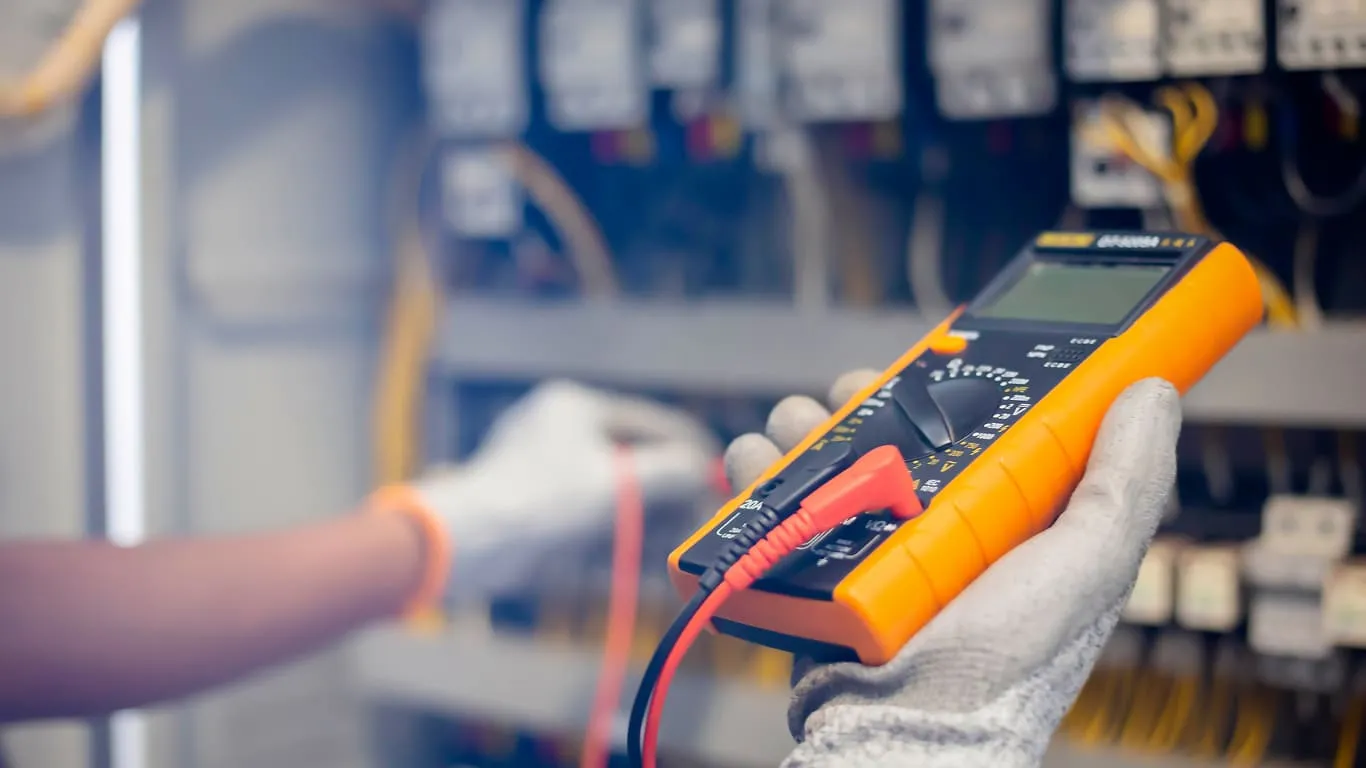 Electrician Using Multimeter