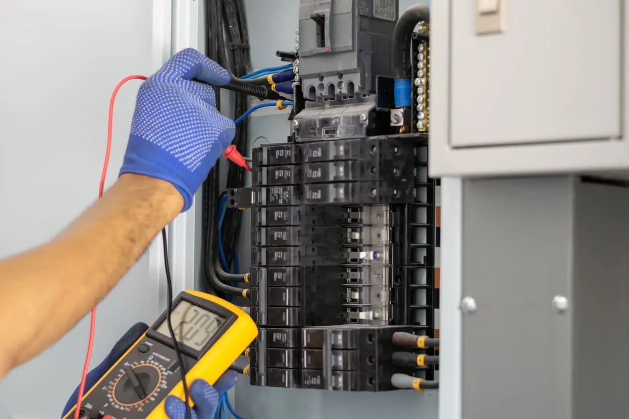 Electrcian Inspecting Breaker Box