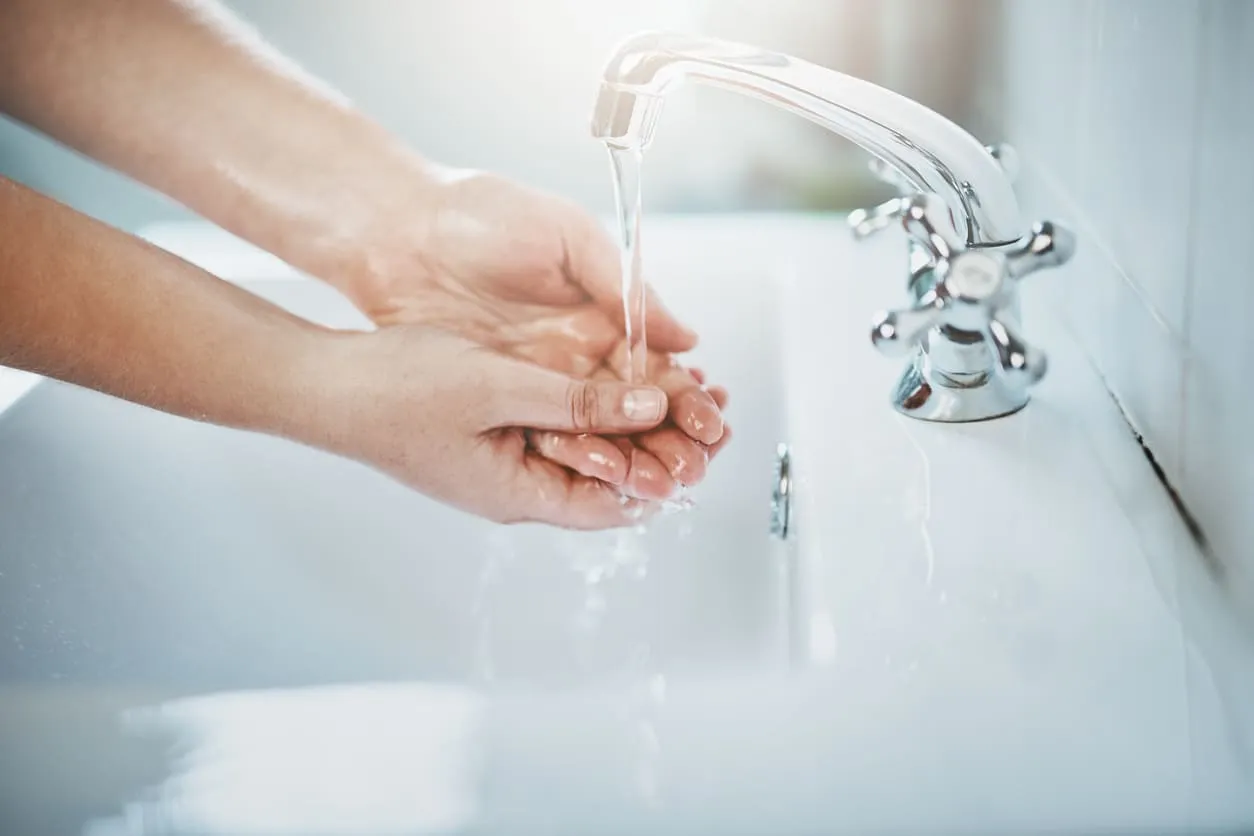 Washing Hands at Bathroom Sink