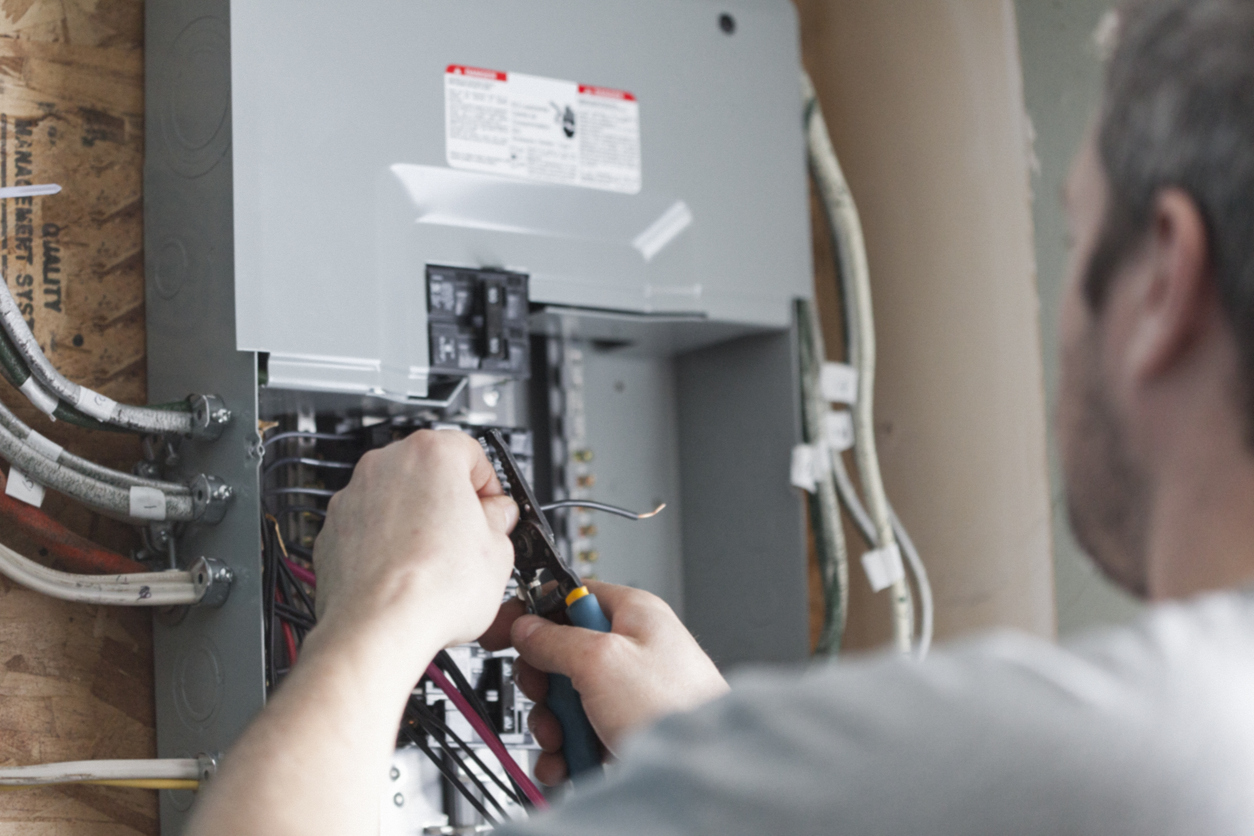 Tech Repairing Circuit Breaker Box