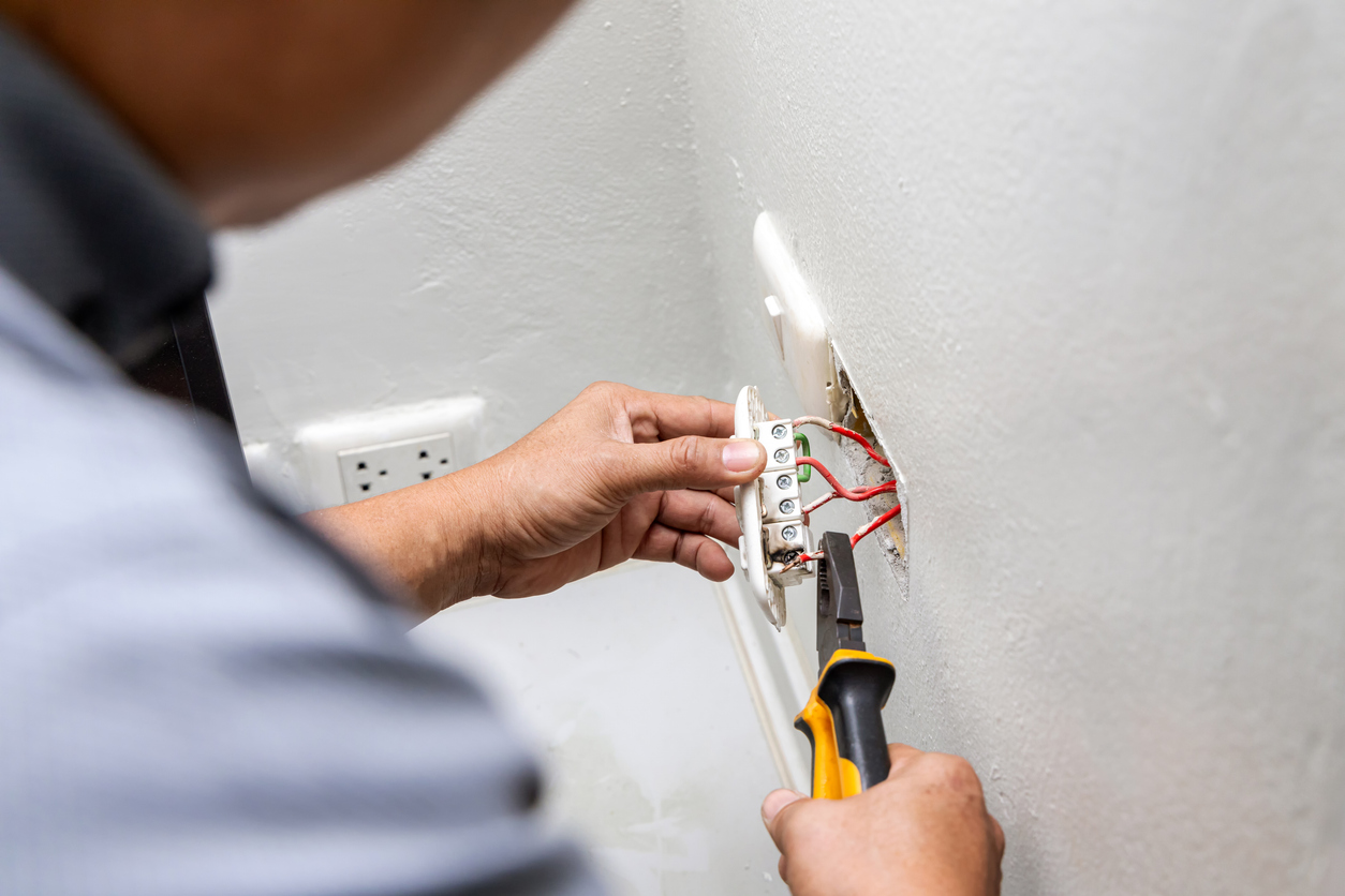 Electrician Repairing Plug